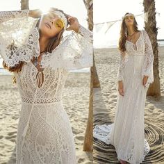 a woman in a white dress on the beach with her eyes closed and hands behind her head