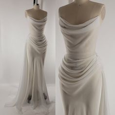 a white dress is on display in front of a mannequin