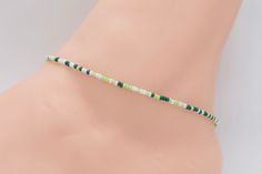 Beach Anklet, Beaded Anklet, Anklet Jewelry, Ankle Bracelet, Boho Anklet, Hippie Anklet, Gift For Her, Women's, Green Anklet, White  Anklet Dainty anklet is made with 11/0 Czech seed beads in different shades of green and white, with 2mm silver filled beads with a lobster clasp.  All items in my store are made buy me. Please send me a message if you want a custom order or need a size that is not listed in the drop down menu.  Size: Measure your anklet above the anklet bone with measuring tape. W Green Beaded Anklets With Round Beads, Adjustable Green Anklets With Tiny Beads, Casual Green Anklets, Dainty Anklet, Diy Friendship Bracelets Tutorial, Bracelets Tutorial, Friendship Bracelets Tutorial, Beaded Anklet, Anklets Boho