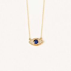 The Diamond Pave Evil Eye Necklace with Sapphire in 14K Solid Gold is a striking piece of jewelry, perfect for any woman who values style and sophistication. With its pave diamond and sapphire design, this necklace provides an aura of protection, making it not just a fashion statement, but a symbol of care and thoughtfulness. 14k solid gold handcrafted pieces 100% ethical sourced jewelry Material: 14k Solid Gold Diamond Quality:Carat Weight: 0.05 ctwColor: F-GClarity: VS2Cut: Excellent Sapphire Diamond Evil Eye, Real Gold Jewelry, Solitaire Necklaces, Protection Necklace, 14k Gold Necklace, Cross Bracelet, Evil Eye Necklace, Engraved Necklace, Evil Eye Bracelet