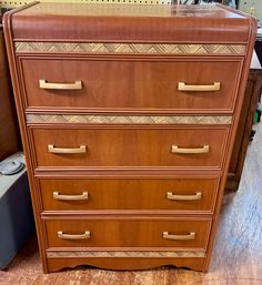 a wooden dresser with many drawers and handles