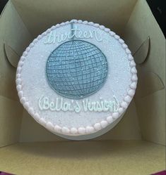 a cake in a box with the words hello venus written on it's side