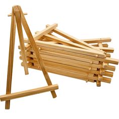 a pile of wooden dows sitting next to each other on top of a white background