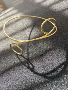 Cute & lightweight. It is adjustable so can be worn as an arm cuff or a choker (or any other way you see fit)! Size is based neck circumference. Feel free to send me a message with your exact measurements for a more custom fit! Note: I think the gold is best for this item. It keeps it shape better than the silver, but the silver is pretty easy to reshape Chic Handmade Adjustable Choker, Chic Choker For Spring Gift, Adjustable Choker For Gifts In Spring, Trendy Gold Choker With Adjustable Length, Adjustable Minimalist Choker For Party, Minimalist Adjustable Choker For Party, Adjustable Spring Choker As Gift, Adjustable Spring Choker For Gifts, Trendy Adjustable Gold Choker