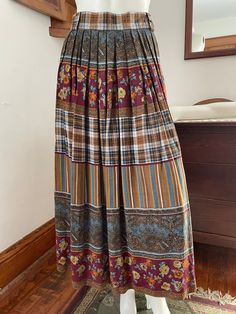 Side zip with elastic in back. large belt loops. Long skirt with pleats. Beautiful bohemian look. Made in Germany Size 16 Like-new condition See pictures