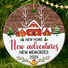 a christmas ornament that says new home, new adventures, and houses in the snow