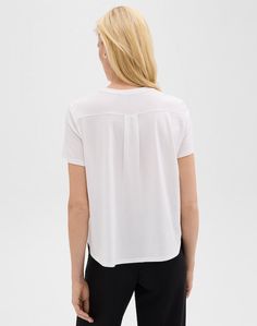 Elevate your wardrobe with our Easy Relaxed Tee Black. Made from ultra-soft organic Pima cotton jersey knit and dyed in Peru, this on-trend short-sleeve tee offers a luxurious and oversized fit. Complete with a patch pocket and back box pleat, this top exudes effortless elegance. Details Short Sleeve Oversized Tee Patch Pocket Style # O0724502 Materials 100% Organic Pima Cotton Care Machine wash on a cold, gentle cycle with similar colors Summer Viscose T-shirt With Short Sleeves, Versatile T-shirt With Shirttail Hem, Effortless Short Sleeve T-shirt For Loungewear, Relaxed Tops With Shirttail Hem For Casual Gatherings, Relaxed Fit V-neck T-shirt For Casual Gatherings, Relaxed Crew Neck Short Sleeve Top For Summer, Relaxed Fit Short Sleeve Top, Versatile Relaxed Fit T-shirt For Summer, Casual Crew Neck Short Sleeve Top