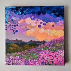 an oil painting of flowers and mountains with clouds in the sky over them at sunset