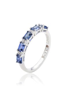 A polished sterling silver ring features baguette-cut pink or blue sapphires and round lab-created white sapphires for elegant sparkle. 1/4" band width Sterling silver/blue or pink sapphire/lab-created white sapphire Imported Sapphire Rings With Baguette Diamonds, Silver Sapphire Ring With Baguette Diamonds, Fine Jewelry White Gold Sapphire Ring With Baguette Diamonds, White Gold Sapphire Ring With Baguette Diamonds, Silver Sapphire Ring, Blue Or Pink, Pink Or Blue, Baguette Cut, White Sapphire