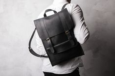 SEE MORE BACKPACKS IN OUR SHOP  https://www.etsy.com/shop/LeatheryCo?ref=shop_sugg&section_id=25759343 Black unisex backpack. One of the best selling backpacks of this season. Can serve as a gift to your family members or just a friend. We can put your initials on this product or perform any other modification, especially for you! PERSONALIZATION Pick any idea to make engraving - Engrave your initials or name; - Engrave your logo; - Engrave your text; MAIN CHARECTERISTICS ◄Size: - 37 x 28 х 10 c Leather Backpack Men, Dark Brown Leather Bag, Vintage Leather Backpack, Handmade Leather Backpack, Laptop Bag Men, Leather Backpack For Men, Mini Backpack Purse, Leather Laptop Backpack, Mini Mochila