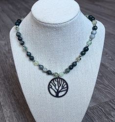 This gorgeous and calming piece is just in time for spring and st pattys day :) It's made with grass agate, moss agate, prehnite, hematite spacers and stainless steel findings. It's fitting for any look and the closer you look the more unique it is!  This necklace is about 17.5 inches and extendable to 20.5! Tips for care: - hang horizontally in a dry place away from sunlight  -put on carefully  -keep away from small pets and children  -avoid swimming, showering, and sleeping in your jewelry! Handmade Adjustable Moss Agate Necklace, Green Nature-inspired Beaded Necklace, Nature-inspired Gemstone Beaded Necklaces As Gifts, Spiritual Green Onyx Necklace, Green Nature-inspired Beaded Necklace With Round Beads, Nature-inspired Gemstone Beads Necklace As Gift, Nature-inspired Gemstone Beads Necklace For Gift, Green Agate Necklace For Gift, Nature-inspired Green Beaded Necklace With Round Beads