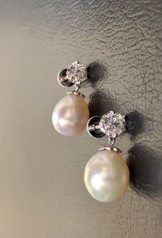 DeKara Designs Collection Metal- 95% Platinum, 5% Iridium. Stones-2 Pear Shape South Sea Pearls 11.3 MM. 2 Old European Cut Round Diamonds G-H Color VS1 Clarity 1.80 Carats, 16 Round Old Mine Cut Diamonds G Color SI1 Clarity 0.04 Carats. Measurement- 1 Inches Long, 0.50 Inch Wide. Handmade Platinum Art Deco Inspired South Sea Pearl Diamond Drop Earrings. There are two beautiful South Sea Pearls dangling right underneath two round Antique Old European Cut Diamonds. There are eight bezel/burnish s Classic White Gold Pearl Earrings, Classic Platinum Pearl Earrings For Formal Occasions, Classic Silver Platinum Pearl Earrings, White Platinum Hallmarked Earrings, Classic Hallmarked Pear-shaped Diamond Earrings, Luxury Pear-shaped Pearl Drop Diamond Earrings, Oval High Luster Pearl Earrings For Formal Events, Formal High Luster Oval Pearl Earrings, Luxury High Luster Oval Earrings