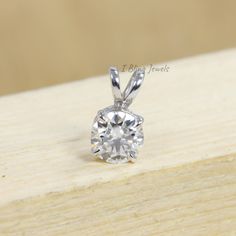 Moissanite Solitaire Pendant / 1.10 CT Round Moissanite 6 Prong Pendant / 10K White Gold Solitaire Pendant / Wedding Gift For Your Wife / Moissanite Diamond Pendant / Solitaire Diamond Pendant / Anniversary Gift For Your Wife ✥ SKU No.: IBS103 ✥ 𝐒𝐭𝐨𝐧𝐞 𝐃𝐞𝐭𝐚𝐢𝐥𝐬: ➻ Shape: Round ➻ Weight: 1.00 CT ➻ Size: 6.50 MM ➻ Color: Colorless ➻ Clarity: VVS ✥ 𝐉𝐞𝐰𝐞𝐥𝐫𝐲 𝐃𝐞𝐭𝐚𝐢𝐥𝐬 ➻ It can be made in 925 Sterling Silver / 935 Argentium Silver and 10K/14K/18K Solid Gold ➻ Gold metal tones can Wedding Solitaire Diamond Necklace, Wedding Silver Solitaire Necklace, Wedding Solitaire Necklace In Sterling Silver, Vs Clarity, Wedding Solitaire Necklace With Round Cut, Round Cut Solitaire Necklace For Wedding, Sterling Silver Solitaire Necklace For Wedding, Diamond White Wedding Jewelry With Bail, Diamond White Jewelry With Bail For Wedding, Vvs Jewelry