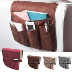 multi pockets hanging on the back of a couch with cell phones and pens in it