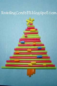 a christmas tree made out of pencils and crayons on a piece of paper