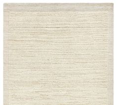 a white rug with wavy lines on the top and bottom, in different shades of beige