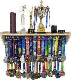 a wooden shelf filled with medals and trophies