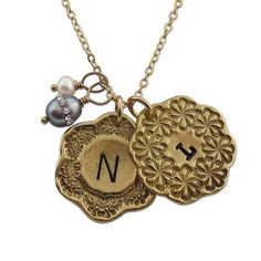 Callista Charm Necklace - IsabelleGraceJewelry Engraved Brass Medallion Charm Necklaces, Engraved Medallion Brass Charm Necklaces, Engraved Medallion Charm Necklace In Brass, Engraved Brass Medallion Charm Necklace, Brass Initial Pendant Necklace With Charms, Vintage Charm Medallion Sterling Silver Necklace, Sterling Silver Medallion Necklace With Vintage Charm, Sterling Silver Vintage Medallion Necklace, Bronze Medallion Necklaces With Charms