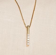 Our Solid Gold Diamond Vertical Bar Necklace is perfect for all the classic-lovers out there. With being gorgeous and elegant, it is an essential for your jewelry box. F E A T U R E S * Made to order. * Gold KT: 14K * Choice of Gold Color: Yellow Gold, Rose Gold, White Gold * Diamond Quality: Diamond carat: 0.02 ct. Clarity: VS2 Color: F-G Cut: Excellent cut Diamond type: Natural Setting Type: Prong Setting * Pendant Height: 15 mm / 0.59 inch * Pendant Width: 1 mm / 0.03 inch * Length: 14", 16", 18", 20" * Ready to Ship in 1-3 Business Days * 100% US sourced * 2-year warranty * Free Express International Shipping * Free returns within 14 days from the order date More * From * U s ▶ Want to find out more? Check out my shop https://www.etsy.com/shop/GelinDiamond ▶ Want to find out more about Elegant 14k Gold Bar Necklace For Anniversary, Minimalist 14k Gold Bar Necklace For Anniversary, Minimalist Yellow Gold Bar Necklace For Anniversary, Classic Yellow Gold Bar Necklace For Anniversary, 14k Gold Bar Necklace For Anniversary, Classic 14k Gold Bar Necklace For Formal Occasions, Classic Yellow Gold Bar Necklace For Formal Occasions, Elegant 14k Gold Rectangular Bar Necklace, Classic Everyday 14k Gold Bar Necklace