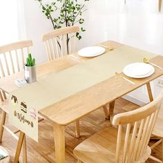 a wooden table with white plates on it