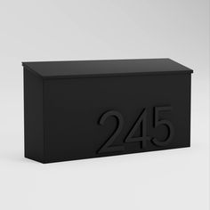 a black mailbox with the number twenty four on it