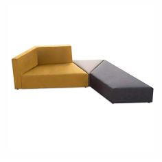 two different colored couches sitting next to each other on a white background, one is yellow and the other is gray