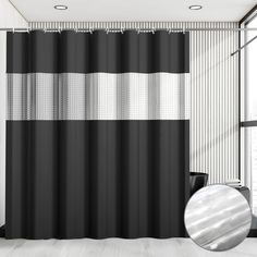 a black and white shower curtain hanging in front of a window