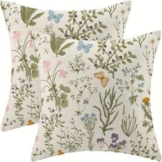 two pillows with floral designs on them