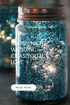 two jars filled with blue glitter sitting on top of a table next to each other