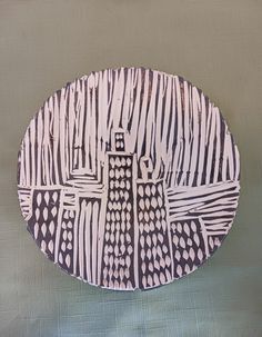 a paper plate with black and white designs on it