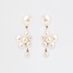 From Copenhagen designer Sophie Bille Brahe, comes a gorgeous pair of pearl drop earrings. Designed to be treasured today and passed down to generations to come, Sophie's designs takes a modern spin on classic pearl jewelry. Without any unnecessary embellishment, these pearl earring speaks for themself. Gorgeous compos Luxury Pearl Embellished Earrings For Formal Occasions, Luxury Drop Pearl Earrings For Formal Events, Luxury Drop Pearl Earrings For Formal Occasions, Elegant Pearl Earrings With High Luster For Evenings, Modern Pearl Earrings For Anniversary, Elegant Drop Earrings With High Luster, Elegant High Luster Drop Earrings, Luxury Pearl Earrings With Pearl Charm, Modern Pearl Drop Earrings For Everyday Elegance