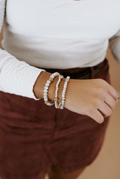 The most essential bracelet stack! We adore this bracelet stack styled with limitless looks to elevate any look! Set of three Ivory bracelet stack Tassel details Packaged with love and shipped from our warehouse in Wilmington, Ohio White Stackable Beaded Bracelets For Everyday, Trendy White Stacked Bracelets, White Beaded Bracelets For Everyday, Everyday Stacked Bracelets, White Stacked Beaded Bracelets, Trendy White Stacked Beaded Bracelets, Adjustable White Wrap Bracelet For Everyday, Adjustable White Beaded Bracelets For Layering, Trendy Cream Bracelets