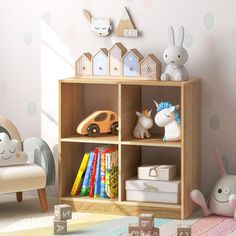 a child's room with toys and bookshelves on the floor, along with polka dot wallpaper