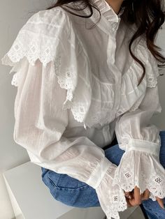 Uber stylish loose fit cotton embroidered blouse with button front, ruffle collar and cuff details. Model is in MINUSEY ONE SIZE. Please allow 5-12 days shipping when in restocking. * MINUSEY ONE SIZE = EU 34-38, US 2-6* 100% Cotton* Dry clean* Made in Korea - Model Height: 170cm/5'7" (US2, EU34) Casual White Blouse With Lace Cuffs, White Cotton Blouse With Lace Cuffs, Cotton Blouse With Lace Cuffs, White Long Sleeve Blouse With Smocked Cuffs, Collared Top With Lace Cuffs, White Blouse With Lace Cuffs For Work, White Lace Cuffs Blouse For Work, Casual Cotton Blouse With Lace Cuffs, White Cotton Blouse With Bishop Sleeves