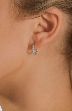 Sparkly cubic zirconia highlight twisted huggie hoop earrings plated in gleaming rhodium for a high-shine finish. 1/2" hoop diameter Snap-post closure Rhodium plate/cubic zirconia Imported Flip Flop Slippers, Ring Watch, Clutch Pouch, Sweaters And Leggings, Huggie Hoop Earrings, Keep Jewelry, Luxury Gifts, Beauty Gift