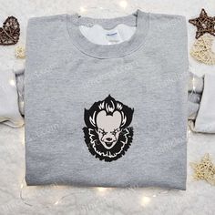 Pennywise Embroidered Hoodie, Clown Face Horror Movie Embroidered Sweatshirt, Best Gifts for Halloween Lovers Hooded Embroidered Sweatshirt For Halloween, Simple Horror Sweatshirt, Halloween Fan Merchandise Cotton Sweatshirt, Halloween Fleece Sweatshirt With Crew Neck, Halloween Embroidered Crew Neck Hoodie, Black Horror-themed Sweatshirt For Fall, Halloween Cotton Hoodie Sweatshirt, White Crew Neck Horror T-shirt, Halloween Fleece Crew Neck Sweatshirt