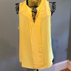 New With Tags Yellow Pleated Sleeveless V-Neck Blouse. Yellow V-neck Vest Top, Elegant Yellow Sleeveless Blouse, Elegant Sleeveless Yellow Blouse, Yellow Sleeveless Blouse For Work, Yellow Sleeveless Spring Blouse, Yellow Sleeveless Summer Blouse, Yellow Sleeveless Blouse For Spring, Sleeveless Yellow Summer Blouse, Yellow Sleeveless Blouse For Summer