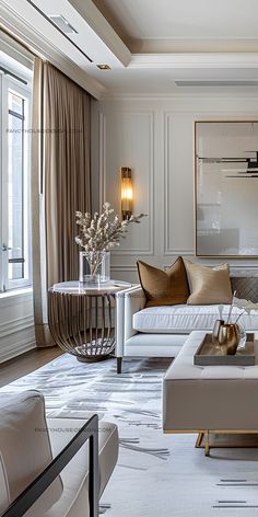 a living room filled with white couches and gold accents on top of it's walls