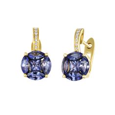 Allow yourself to become blissfully enamored in the mystical blue-purple ray of Tanzanite. This rare and sumptuous gemstone paired with dazzling Diamonds makes for a truly radiant earring. Scroll down to our Gem Guide to learn more about Tanzanite. Measurement: 8 x 15 x 10 mm Weight: 3.12 grams, 18k gold Please allow 4-6 weeks for production. Luxury Tanzanite Gemstone Earrings, Luxury Tanzanite Earrings With Gemstone, Luxury Tanzanite Drop Earrings, Luxury Round Tanzanite Earrings, Sapphire Tanzanite Earrings Fine Jewelry, Blue Tanzanite Round Earrings, Fine Jewelry Sapphire Tanzanite Earrings, Fine Jewelry Tanzanite Earrings In Sapphire Color, Elegant Tanzanite Gemstones With Accent Stones