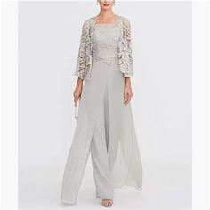 a woman in grey pants and jacket with lace overlays on the shoulders, wearing a