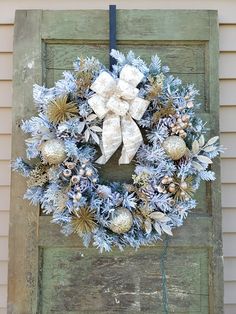 a wreath is hanging on the side of a door