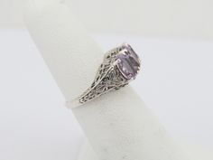 Vintage Sterling Silver Natural Amethyst Filigree Ring ...Marked 925...Total of weights 3.1grams...Size 8...Measure of Face 9.5MM...It's in very good condition. Fine Jewelry Lavender Hallmarked Rings, Sterling Silver Filigree Rings In Purple, Purple Sterling Silver Filigree Rings, Classic Lavender Rings For Anniversary, Classic Lavender Ring For Anniversary, Filigree Ring, Multi Stone Ring, Multi Stone, Vintage Sterling Silver