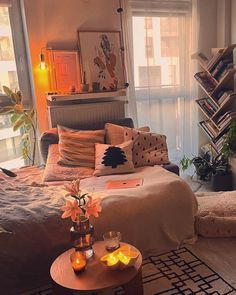 a living room filled with furniture and lots of books on the shelves next to a window