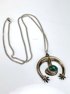 "Vintage Artisan Malachite & Sterling Silver Necklace -Appears to be handmade, artisan design -Abstract, modern design with a single malachite stone, very fine sawtooth bezel set -Pendant is unmarked, tests for Sterling silver -Pendant measures about 1.1\" x 1.1\" with a depth of .4\" -Malachite stone measures 8.5mm x 6mm oval shaped -Comes with a Sterling silver cable chain, 18\", marked Sterling on the clasp -In very nice vintage condition with patina to the silver consistent with age and use. Modern Green Necklace With Polished Finish, Modern Green Malachite Jewelry, Modern Green Collectible Jewelry, Green Oval Modernist Jewelry, Green Modernist Oval Jewelry, Artisan Malachite Jewelry For Jewelry Making, Modernist Green Jewelry For Gifts, Artisan Malachite Pendant Necklace, Artisan Malachite Jewelry For Crafting