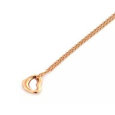 Hallmark: Tiffany & Co. Au750 Peretti Spain  Material:  18k rose gold   Measurement:  Chain is: 16" long       Pendant: 7mm long x 6.8mm wide   Weight: 1.6 grams    This is an elegant authentic necklace from Tiffany & Co. by designer Elsa Peretti from her Open Heart collection. Crafted from 18k rose gold with a polished finish, the pendant is a mini open contour shape heart with a classic link chain. It is signed by the designer with the metal content. Elsa Peretti, Long Pendant, Open Heart, Heart Pendant Necklace, 18k Rose Gold, Tiffany & Co., Link Chain, Heart Pendant, Hallmark