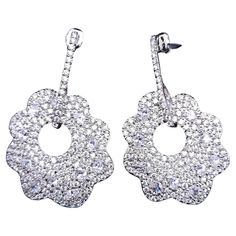 Add a touch of dazzling elegance to your jewelry collection with the Kenneth Jay Lane pave clear cubic zirconia crystal dangle floral earrings. These exquisite earrings feature a dazzling display of pave-set clear cubic zirconia crystals, meticulously arranged on a silver floral motif. The silver-tone setting enhances the brilliance of the stones, creating a radiant sparkle that catches the light with every movement! Pave Jewelry, Flower Crystal, Silver Dangle Earrings, Floral Earrings, Kenneth Jay Lane, Silver Earrings Dangle, Floral Motif, Jewelry Earrings Dangle, Jay