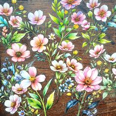 a painting of flowers on a wooden surface