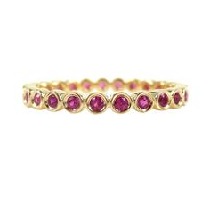 All way around full eternity band features bezel set natural rubies, crafted in 18k yellow gold. All way around full eternity band features 25 round cut bezel-set Ruby gems, a 0.36 Carats total weight. Crafted in solid 18k rose gold. *Based on Ring Size: 6 *Design: Full Eternity *Metal: 18K Yellow Gold *Stones: Ruby *Stone Count: 25 PCS *Weight: 0.36cts T.W *Band Width: 2.2mm (with +/- 0.1mm variation) Please note: Carat weight varies on your requested ring size. Beautiful Ring Box included. ** Yellow Gold Stacking Rings, Ruby Eternity Band, Gold Stacking Rings, Gold Ring Stack, Ruby Stone, Beautiful Ring, Eternity Band, Natural Ruby, Ring Box