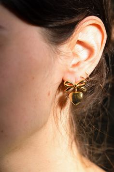 18k gold plated over stainless steel, waterproof, stud bow earrings made with ethically-sourced materials. Nickel / lead free. *Tiny hoops shown in image not included. Gold Plated Internally Threaded Cartilage Earrings For Gift, Preppy Accessories, Bow Organizer, Satin Ribbon Bow, Lint Roller, Bow Accessories, Fabric Bows, Bow Earrings, Handmade Bows