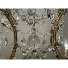 a chandelier with crystal drops hanging from it's sides